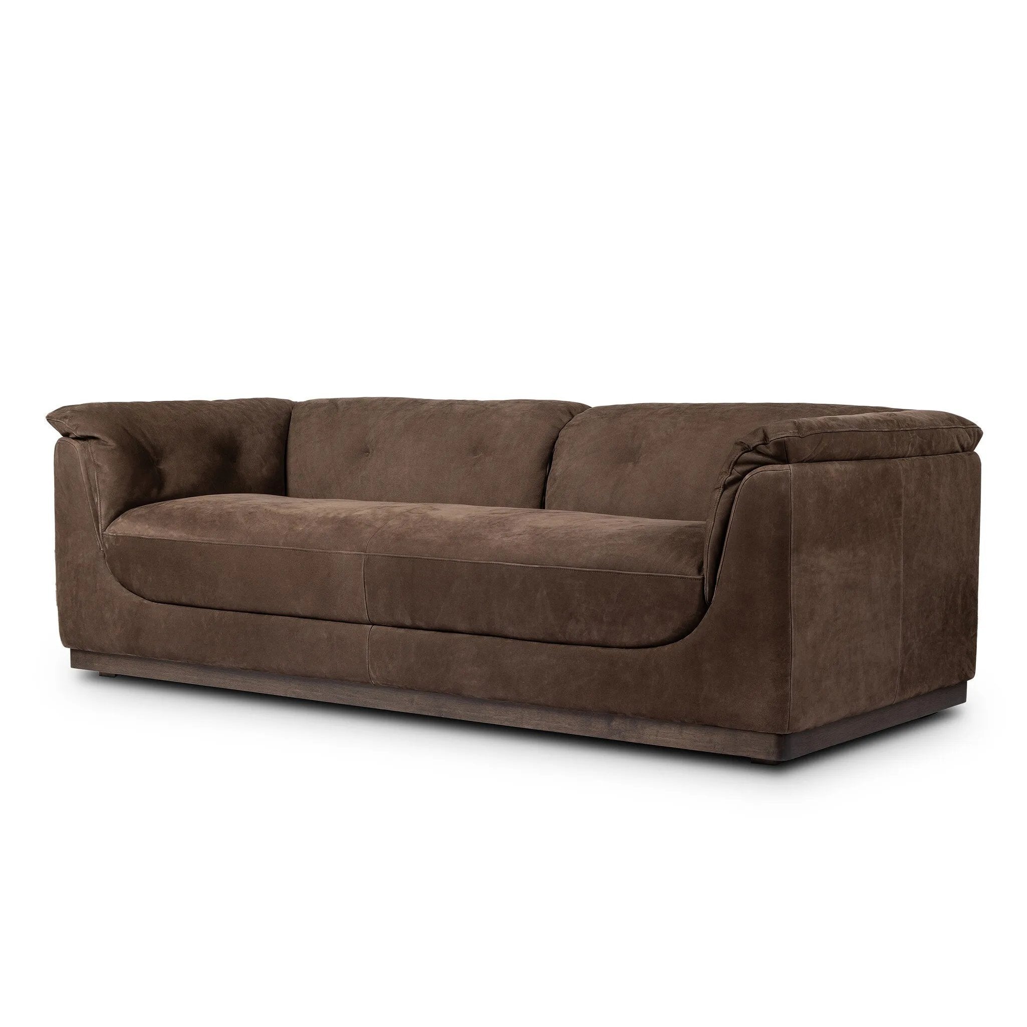 Inspired by 1970s Brutalism, this urban tuxedo sofa balances a rounded solid wood plinth with a curved seat deck and a relaxed, "wrinkled" upholstery design. Feather-blend cushions wrap the frame, finished with dramatic blind tufting for a hand-crafted, textural edge. Amethyst Home provides interior design, new home construction design consulting, vintage area rugs, and lighting in the Laguna Beach metro area.