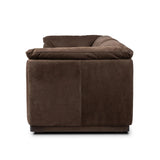 Inspired by 1970s Brutalism, this urban tuxedo sofa balances a rounded solid wood plinth with a curved seat deck and a relaxed, "wrinkled" upholstery design. Feather-blend cushions wrap the frame, finished with dramatic blind tufting for a hand-crafted, textural edge. Amethyst Home provides interior design, new home construction design consulting, vintage area rugs, and lighting in the Miami metro area.