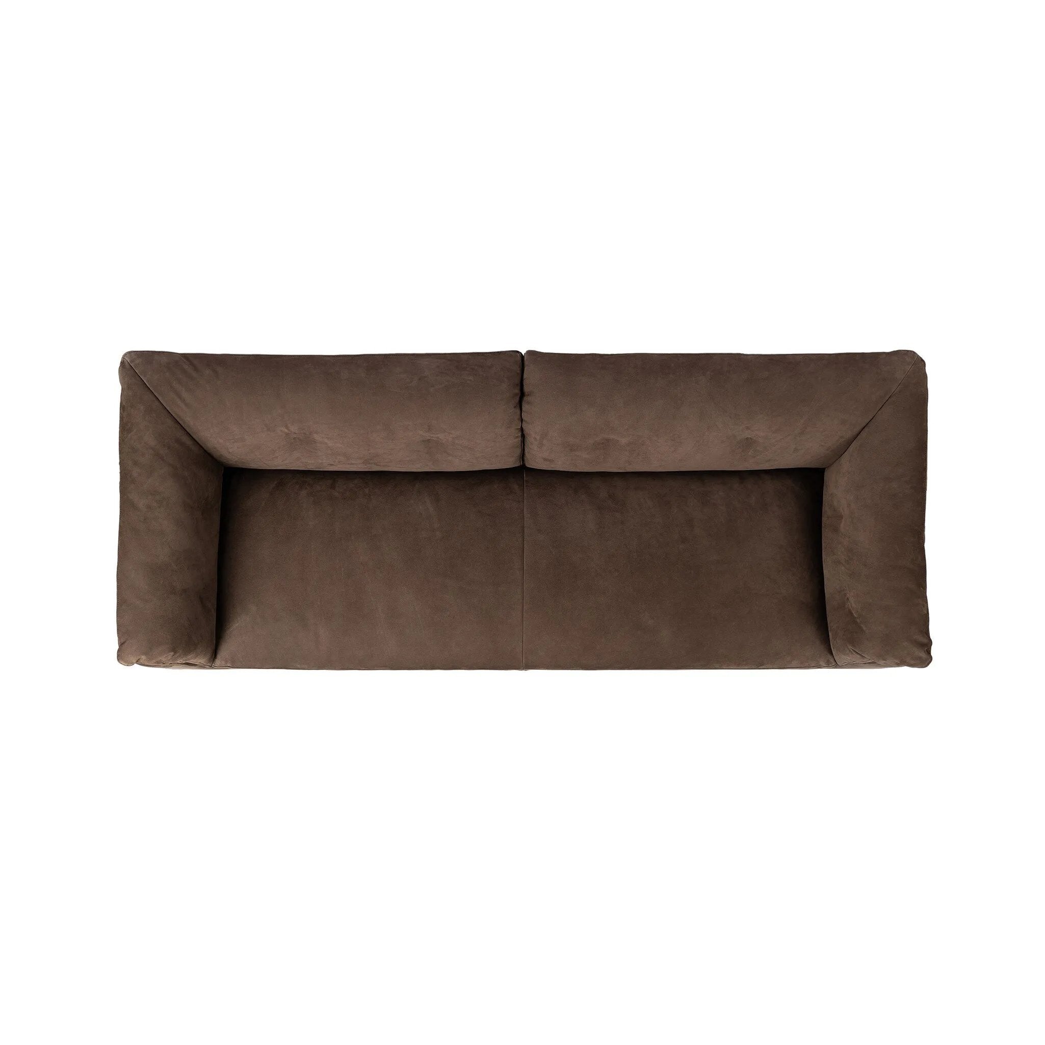 Inspired by 1970s Brutalism, this urban tuxedo sofa balances a rounded solid wood plinth with a curved seat deck and a relaxed, "wrinkled" upholstery design. Feather-blend cushions wrap the frame, finished with dramatic blind tufting for a hand-crafted, textural edge. Amethyst Home provides interior design, new home construction design consulting, vintage area rugs, and lighting in the Park City metro area.