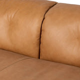 Inspired by 1970s Brutalism, this urban tuxedo sofa balances a rounded solid wood plinth with a curved seat deck and a relaxed, "wrinkled" upholstery design. Feather-blend cushions wrap the frame, finished with dramatic blind tufting for a hand-crafted, textural edge. Amethyst Home provides interior design, new home construction design consulting, vintage area rugs, and lighting in the Dallas metro area.