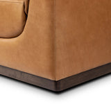 Inspired by 1970s Brutalism, this urban tuxedo sofa balances a rounded solid wood plinth with a curved seat deck and a relaxed, "wrinkled" upholstery design. Feather-blend cushions wrap the frame, finished with dramatic blind tufting for a hand-crafted, textural edge. Amethyst Home provides interior design, new home construction design consulting, vintage area rugs, and lighting in the Newport Beach metro area.