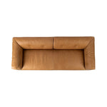 Inspired by 1970s Brutalism, this urban tuxedo sofa balances a rounded solid wood plinth with a curved seat deck and a relaxed, "wrinkled" upholstery design. Feather-blend cushions wrap the frame, finished with dramatic blind tufting for a hand-crafted, textural edge. Amethyst Home provides interior design, new home construction design consulting, vintage area rugs, and lighting in the Salt Lake City metro area.