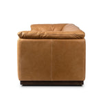 Inspired by 1970s Brutalism, this urban tuxedo sofa balances a rounded solid wood plinth with a curved seat deck and a relaxed, "wrinkled" upholstery design. Feather-blend cushions wrap the frame, finished with dramatic blind tufting for a hand-crafted, textural edge. Amethyst Home provides interior design, new home construction design consulting, vintage area rugs, and lighting in the Washington metro area.