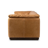 Inspired by 1970s Brutalism, this urban tuxedo sofa balances a rounded solid wood plinth with a curved seat deck and a relaxed, "wrinkled" upholstery design. Feather-blend cushions wrap the frame, finished with dramatic blind tufting for a hand-crafted, textural edge. Amethyst Home provides interior design, new home construction design consulting, vintage area rugs, and lighting in the Washington metro area.