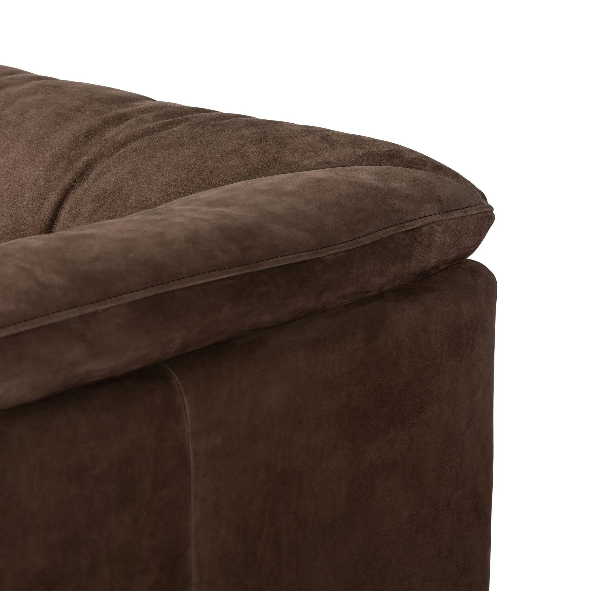 Inspired by 1970s brutalism, this urban swivel chair balances a rounded solid wood plinth with a curved seat deck and a relaxed, "wrinkled" upholstery design. Feather-blend cushions wrap the frame, finished with dramatic blind tufting for a hand-crafted, textural edge. Amethyst Home provides interior design, new home construction design consulting, vintage area rugs, and lighting in the Boston metro area.
