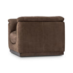 Inspired by 1970s brutalism, this urban swivel chair balances a rounded solid wood plinth with a curved seat deck and a relaxed, "wrinkled" upholstery design. Feather-blend cushions wrap the frame, finished with dramatic blind tufting for a hand-crafted, textural edge. Amethyst Home provides interior design, new home construction design consulting, vintage area rugs, and lighting in the Calabasas metro area.