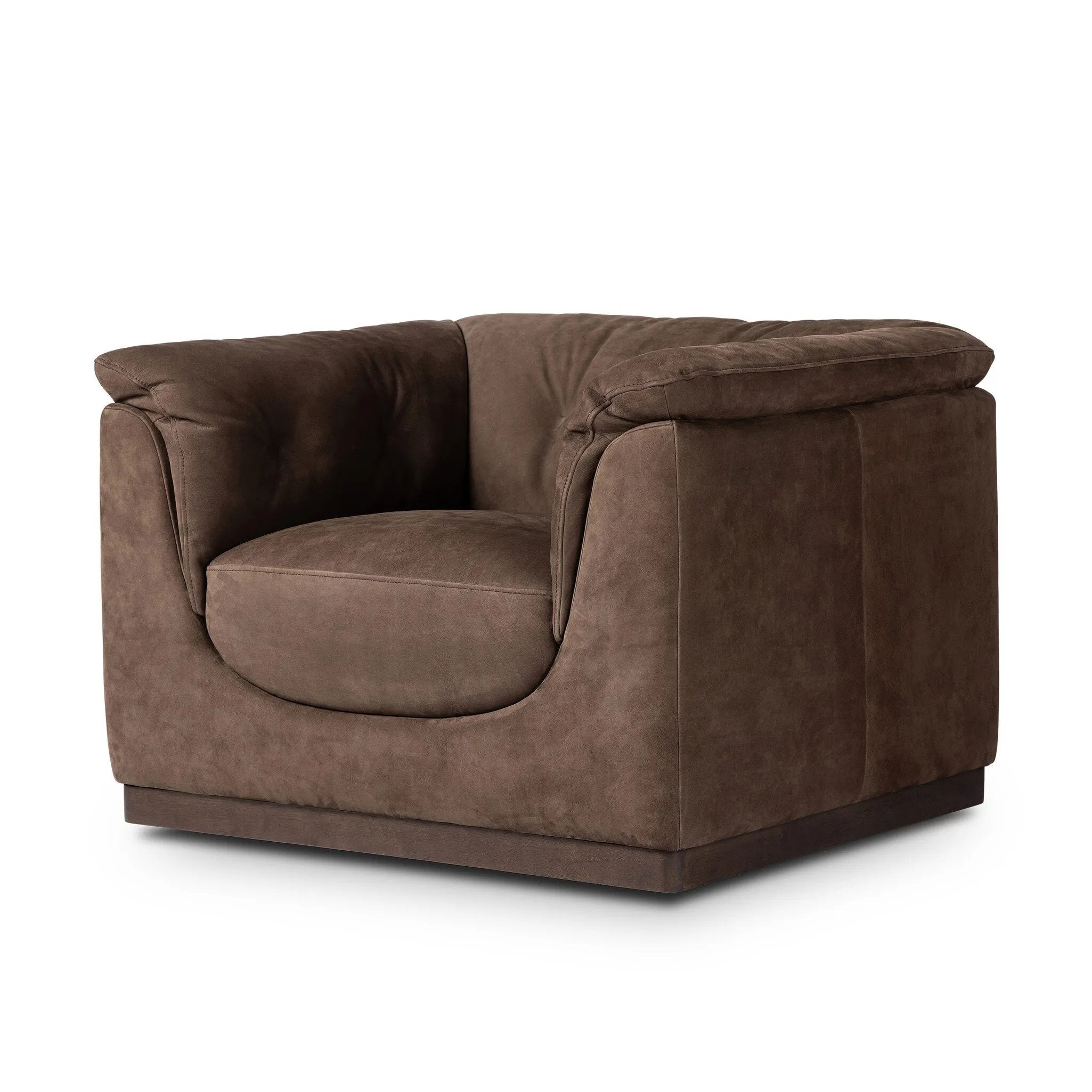 Inspired by 1970s brutalism, this urban swivel chair balances a rounded solid wood plinth with a curved seat deck and a relaxed, "wrinkled" upholstery design. Feather-blend cushions wrap the frame, finished with dramatic blind tufting for a hand-crafted, textural edge. Amethyst Home provides interior design, new home construction design consulting, vintage area rugs, and lighting in the Charlotte metro area.