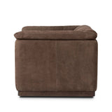 Inspired by 1970s brutalism, this urban swivel chair balances a rounded solid wood plinth with a curved seat deck and a relaxed, "wrinkled" upholstery design. Feather-blend cushions wrap the frame, finished with dramatic blind tufting for a hand-crafted, textural edge. Amethyst Home provides interior design, new home construction design consulting, vintage area rugs, and lighting in the Laguna Beach metro area.