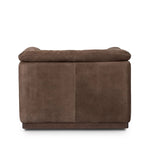 Inspired by 1970s brutalism, this urban swivel chair balances a rounded solid wood plinth with a curved seat deck and a relaxed, "wrinkled" upholstery design. Feather-blend cushions wrap the frame, finished with dramatic blind tufting for a hand-crafted, textural edge. Amethyst Home provides interior design, new home construction design consulting, vintage area rugs, and lighting in the Miami metro area.