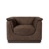 Inspired by 1970s brutalism, this urban swivel chair balances a rounded solid wood plinth with a curved seat deck and a relaxed, "wrinkled" upholstery design. Feather-blend cushions wrap the frame, finished with dramatic blind tufting for a hand-crafted, textural edge. Amethyst Home provides interior design, new home construction design consulting, vintage area rugs, and lighting in the Omaha metro area.