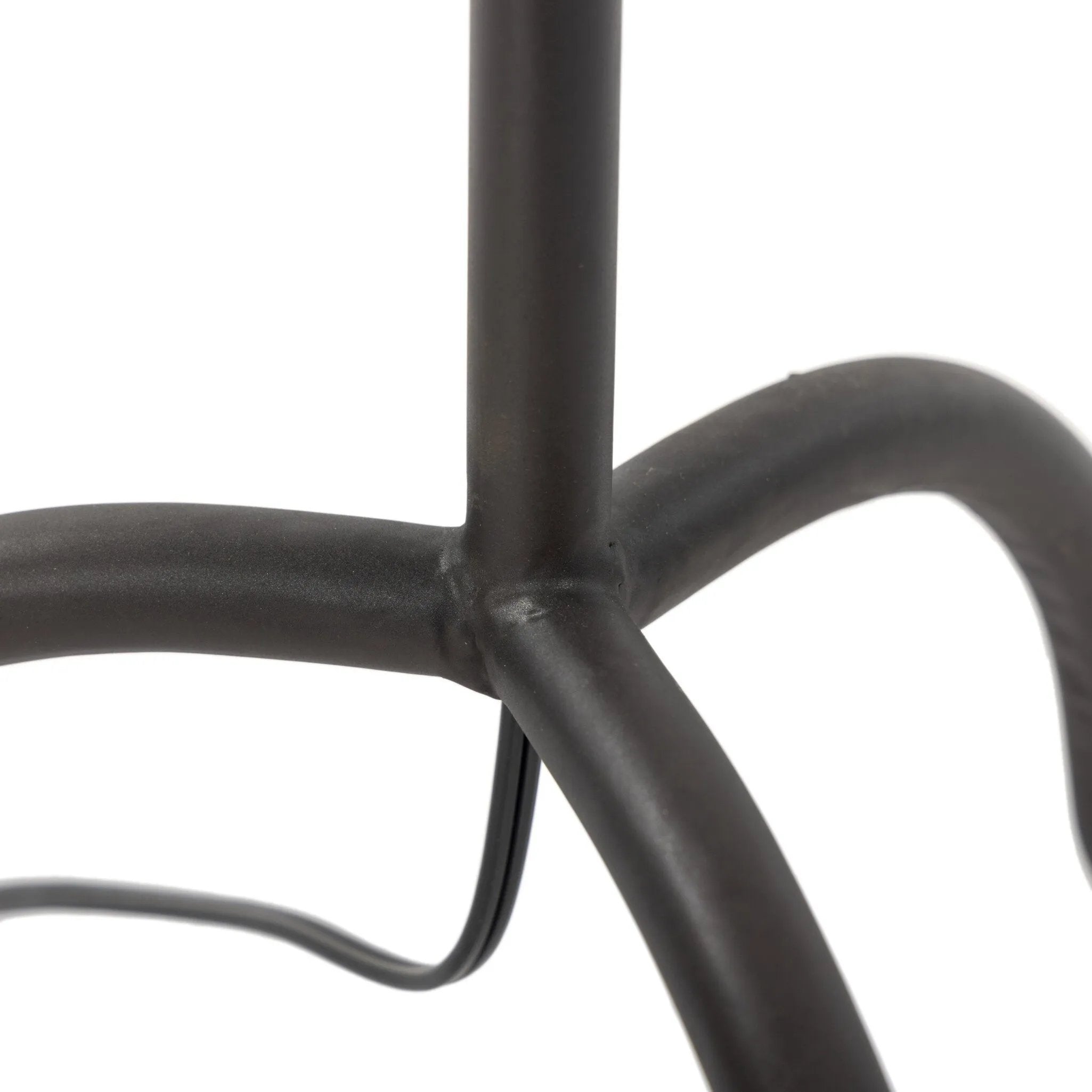 A curved cast iron tripod base pairs with an elongated boucle shade for a sculpted, minimalist look that works into any room with ease Amethyst Home provides interior design, new home construction design consulting, vintage area rugs, and lighting in the Kansas City metro area.