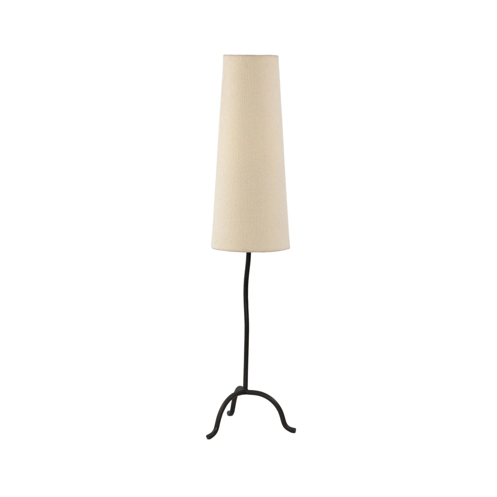 A curved cast iron tripod base pairs with an elongated boucle shade for a sculpted, minimalist look that works into any room with ease Amethyst Home provides interior design, new home construction design consulting, vintage area rugs, and lighting in the Park City metro area.