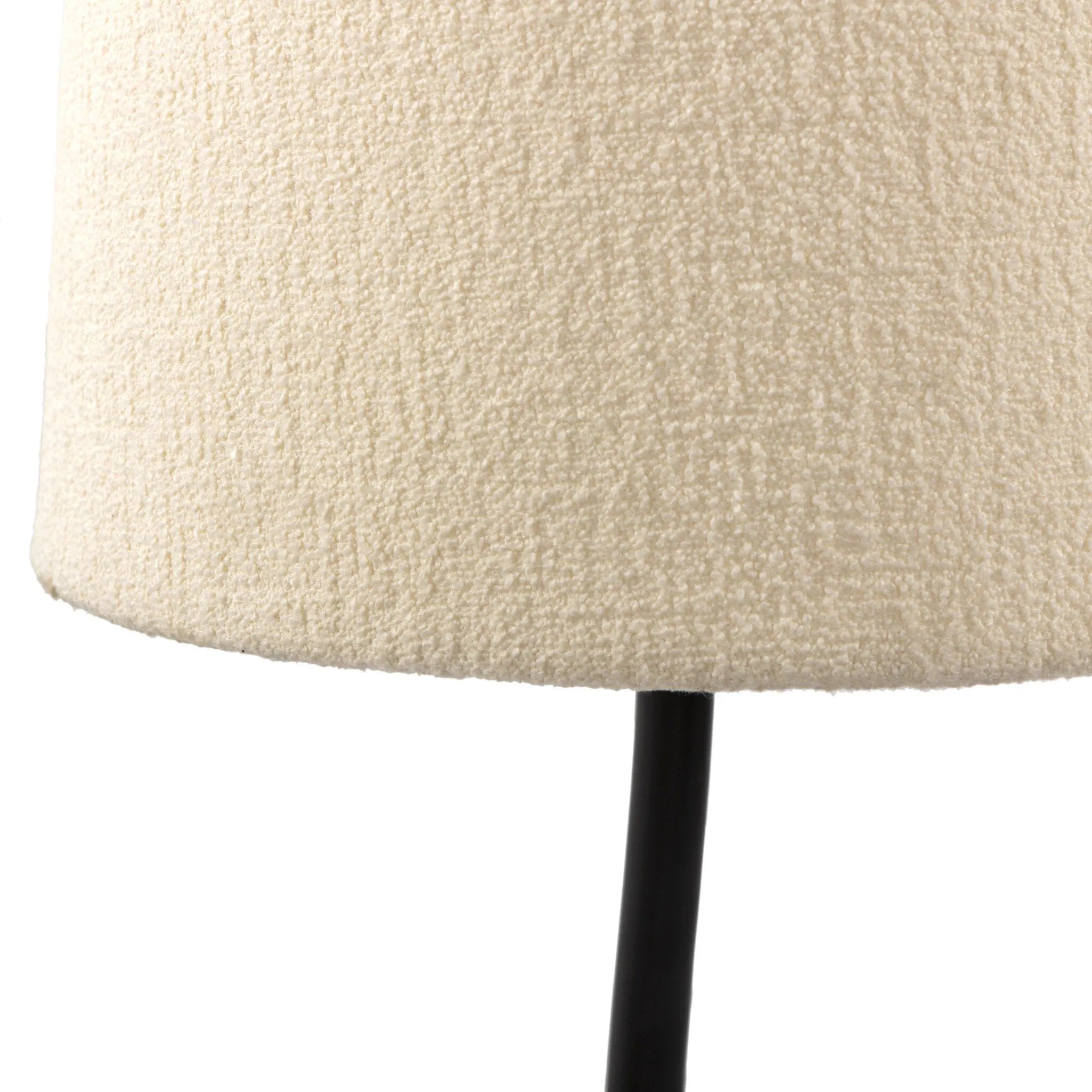 A curved cast iron tripod base pairs with an elongated boucle shade for a sculpted, minimalist look that works into any room with ease Amethyst Home provides interior design, new home construction design consulting, vintage area rugs, and lighting in the Scottsdale metro area.