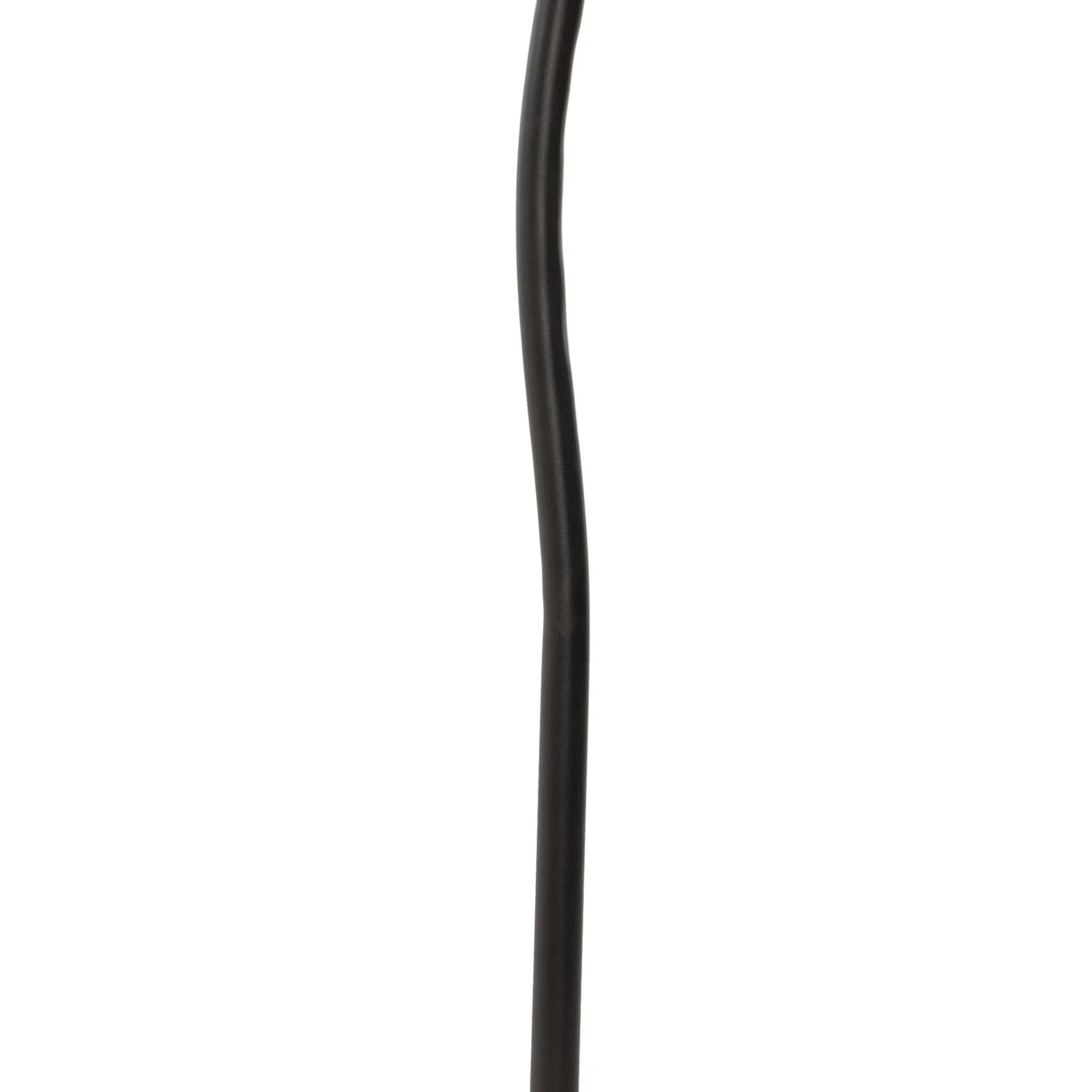 A curved cast iron tripod base pairs with an elongated boucle shade for a sculpted, minimalist look that works into any room with ease Amethyst Home provides interior design, new home construction design consulting, vintage area rugs, and lighting in the Tampa metro area.