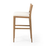 Unique materials make this bar stool a standout. A low, perfectly pitched backrest is made from wrapped paper cord and aged oak, for a natural, textured look. Simple squared seating is upholstered in high-performance fabric, perfect for entertaining. Amethyst Home provides interior design, new home construction design consulting, vintage area rugs, and lighting in the Salt Lake City metro area.