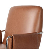 Shiny stainless steel frames tan top-grain leather cushioning for a balance of comfort and edge. Overfilled for a relaxed sit, the cushioned seat and back keep things supportive. Adjustable height and smooth 360-swivel bring ease to your workspace Amethyst Home provides interior design, new home construction design consulting, vintage area rugs, and lighting in the Boston metro area.