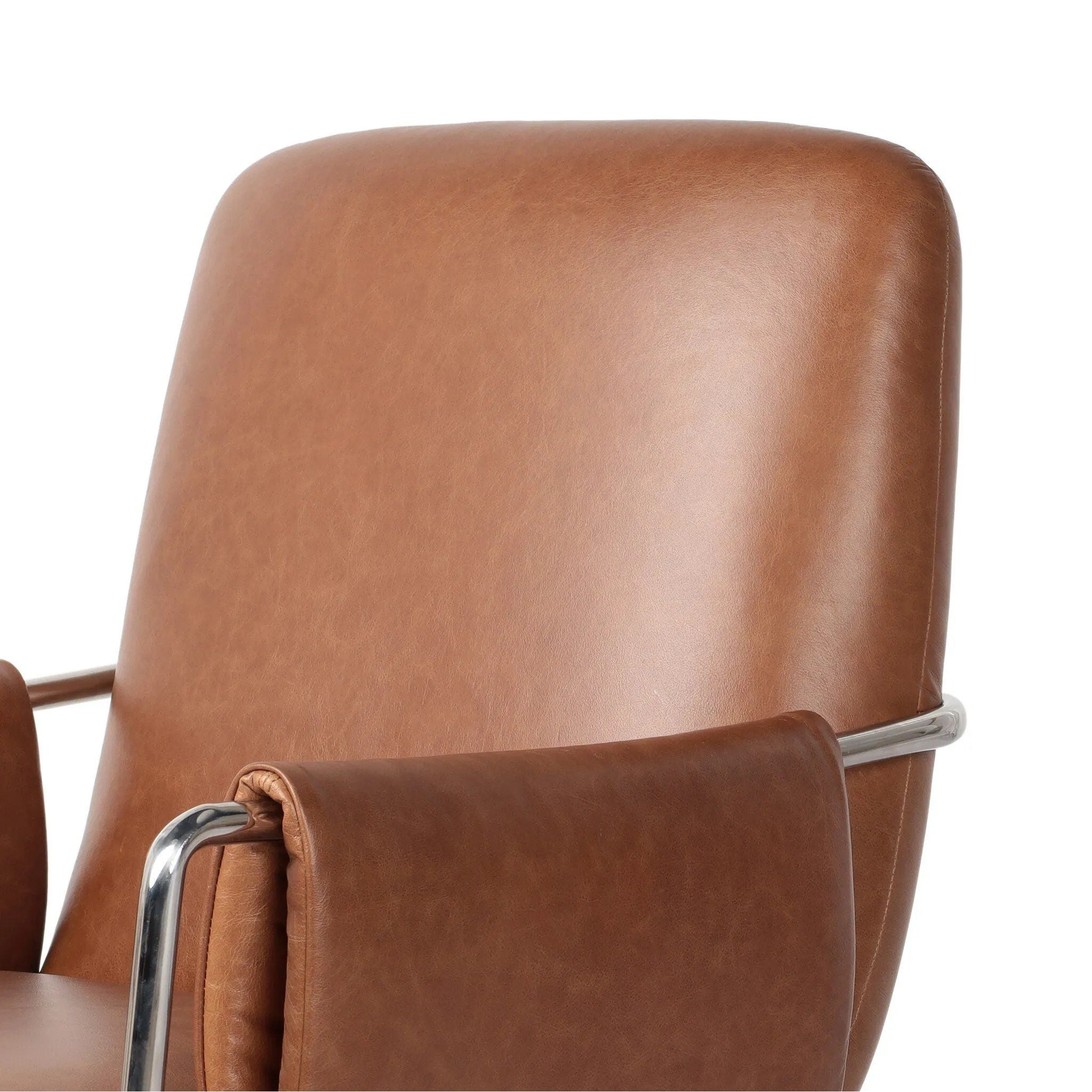 Shiny stainless steel frames tan top-grain leather cushioning for a balance of comfort and edge. Overfilled for a relaxed sit, the cushioned seat and back keep things supportive. Adjustable height and smooth 360-swivel bring ease to your workspace Amethyst Home provides interior design, new home construction design consulting, vintage area rugs, and lighting in the Boston metro area.
