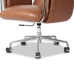 Shiny stainless steel frames tan top-grain leather cushioning for a balance of comfort and edge. Overfilled for a relaxed sit, the cushioned seat and back keep things supportive. Adjustable height and smooth 360-swivel bring ease to your workspace Amethyst Home provides interior design, new home construction design consulting, vintage area rugs, and lighting in the Scottsdale metro area.