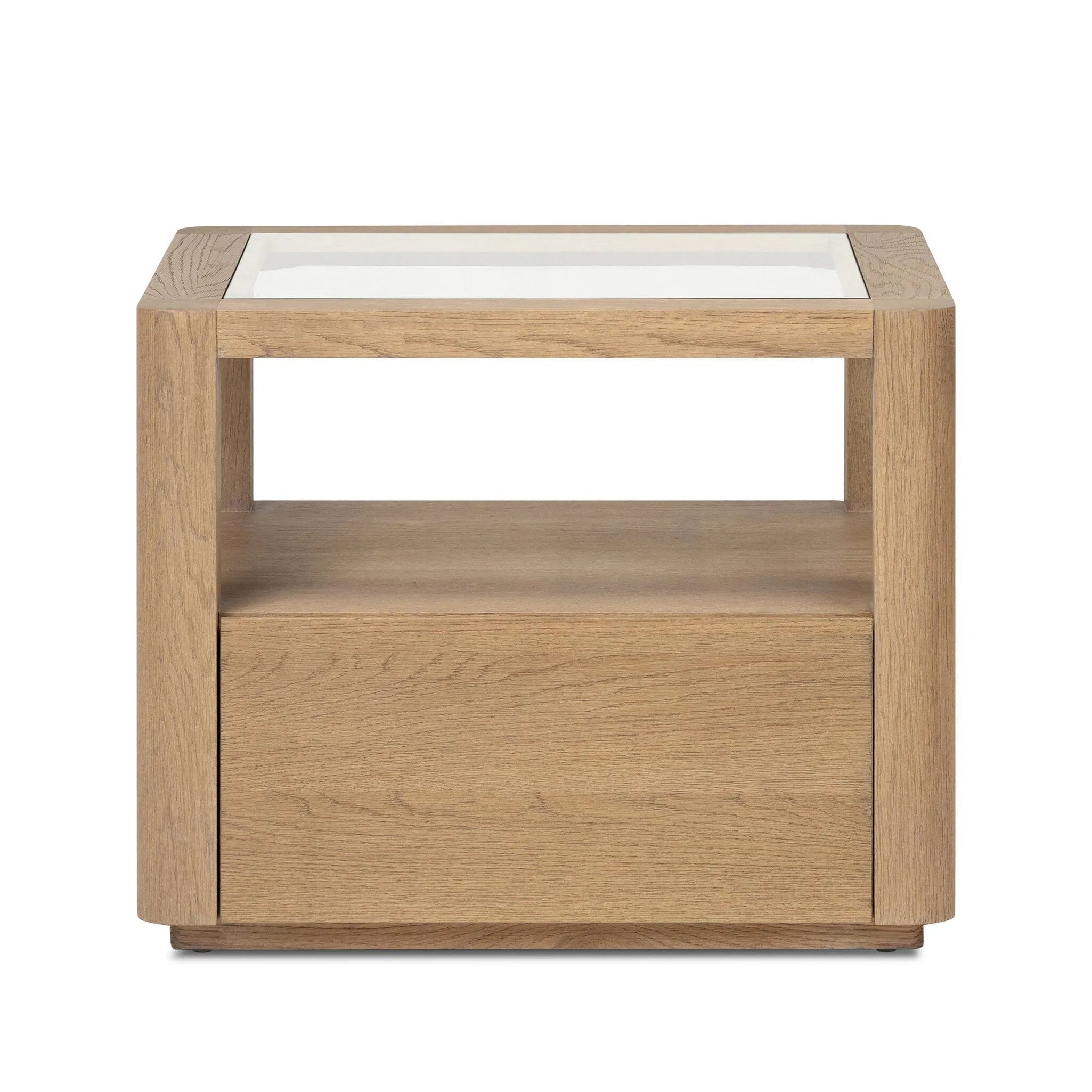 Bring bonus storage and a light look to the living space. Made from sandy oak and clear tempered glass with a single drawer, shelving beneath the glass doubles as a shadowbox or an extra display surface.As lovers of clean materials at Amethyst, we love the designer inspired Shiloh End Table - Tempered Glass. Amethyst Home provides interior design, new home construction design consulting, vintage area rugs, and lighting in the Monterey metro area.