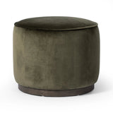 Upholstered in a deep olive velvet and paired with a rich brown base, this rounded ottoman can be placed just about anywhere. Light, versatile color can move between spaces and style with ease Amethyst Home provides interior design, new home construction design consulting, vintage area rugs, and lighting in the Houston metro area.