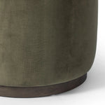 Upholstered in a deep olive velvet and paired with a rich brown base, this rounded ottoman can be placed just about anywhere. Light, versatile color can move between spaces and style with ease Amethyst Home provides interior design, new home construction design consulting, vintage area rugs, and lighting in the Laguna Beach metro area.