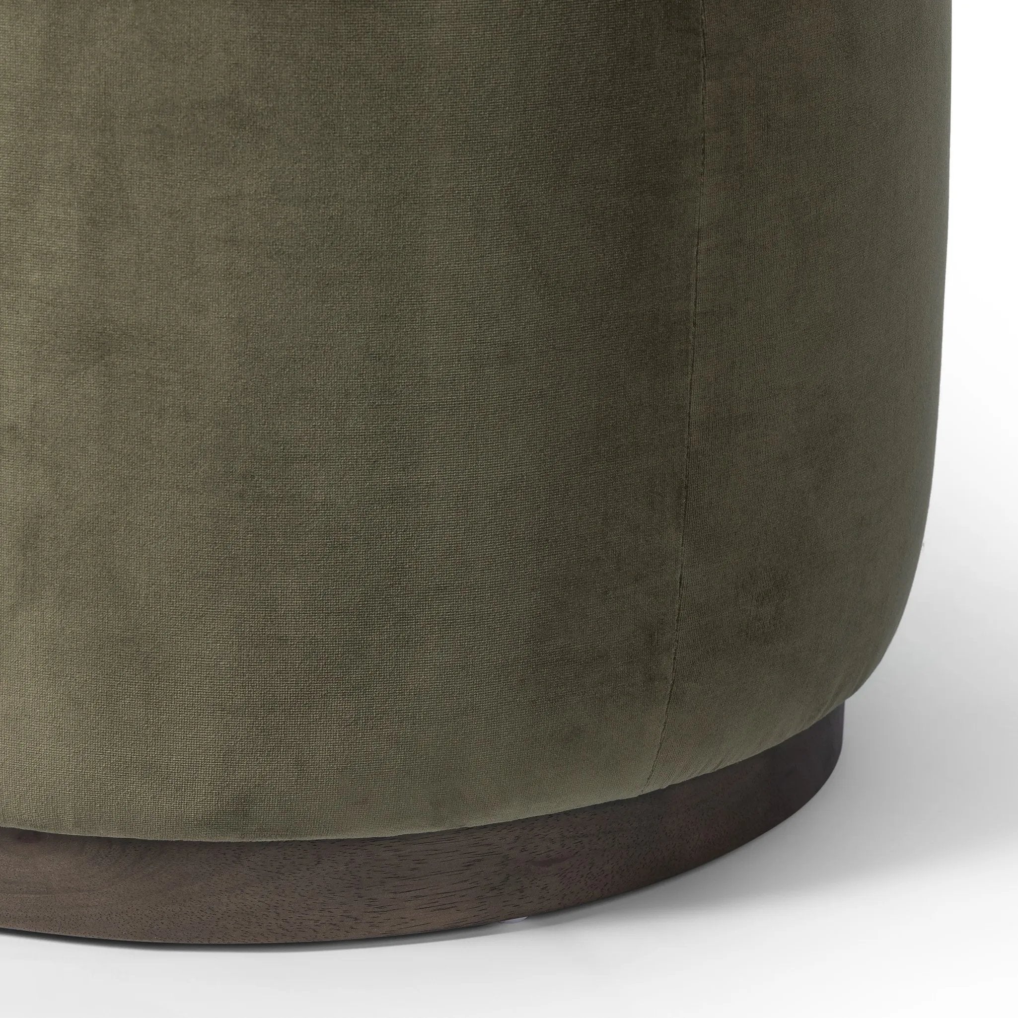 Upholstered in a deep olive velvet and paired with a rich brown base, this rounded ottoman can be placed just about anywhere. Light, versatile color can move between spaces and style with ease Amethyst Home provides interior design, new home construction design consulting, vintage area rugs, and lighting in the Laguna Beach metro area.