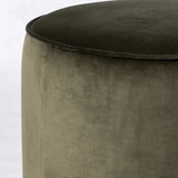Upholstered in a deep olive velvet and paired with a rich brown base, this rounded ottoman can be placed just about anywhere. Light, versatile color can move between spaces and style with ease Amethyst Home provides interior design, new home construction design consulting, vintage area rugs, and lighting in the Nashville metro area.