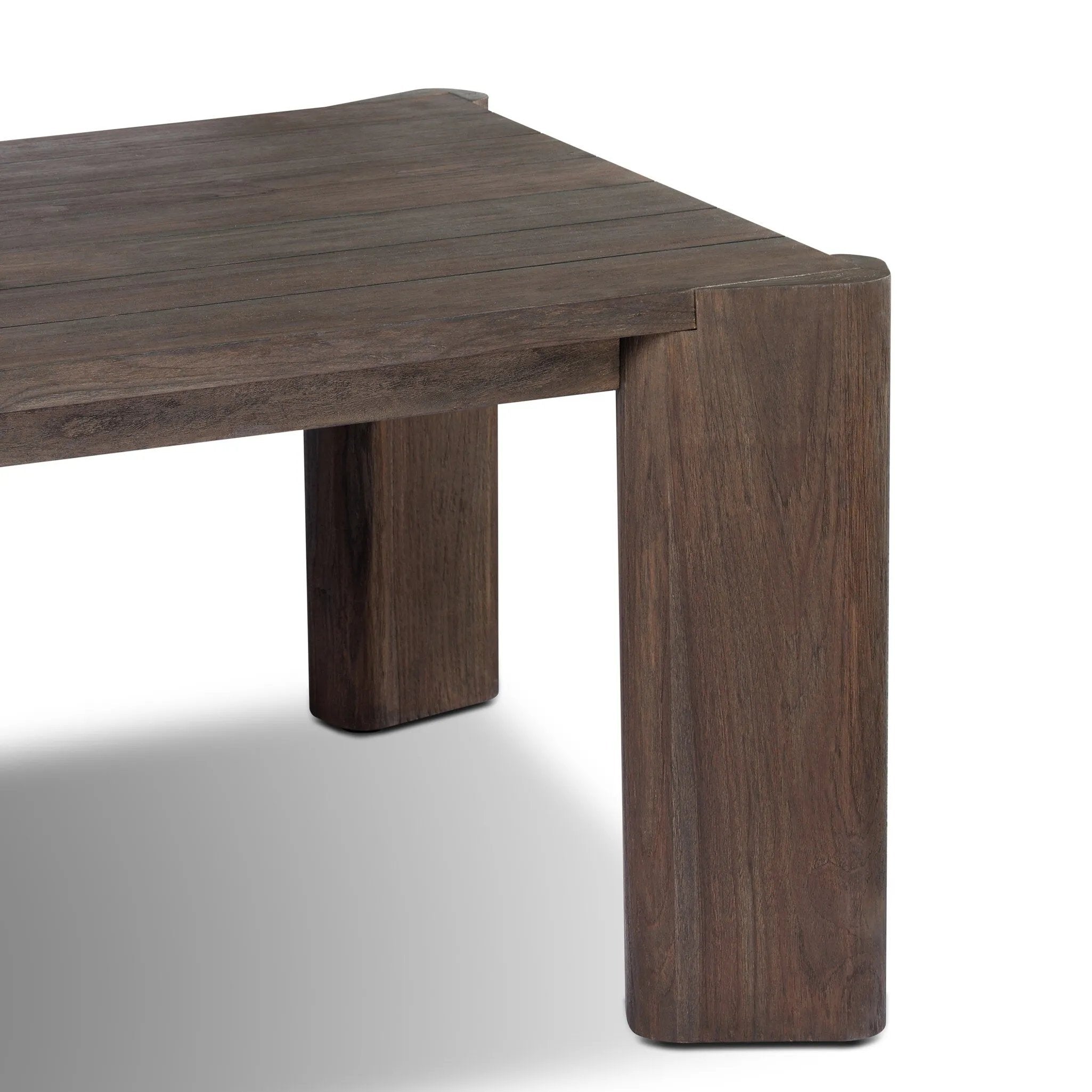 This Parsons-style outdoor dining table is defined by heavy proportions and over-scaled angled legs. Crafted from reclaimed wood and finished with a heritage brown stain to showcase natural cracks and patches for added character. Cover or store indoors during inclement weather and when not in use Amethyst Home provides interior design, new home construction design consulting, vintage area rugs, and lighting in the Charlotte metro area.