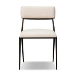 Bring a slim, light look to the dining room. This dining chair pairs cream performance fabric exclusive to Four Hands and bronzed iron to craft a simple, airy look. A tapered leg and decorative handle on the back elevate the look. Amethyst Home provides interior design, new home construction design consulting, vintage area rugs, and lighting in the Houston metro area.