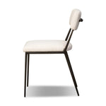 Bring a slim, light look to the dining room. This dining chair pairs cream performance fabric exclusive to Four Hands and bronzed iron to craft a simple, airy look. A tapered leg and decorative handle on the back elevate the look. Amethyst Home provides interior design, new home construction design consulting, vintage area rugs, and lighting in the San Diego metro area.