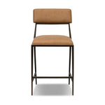 Bring a slim, light look to the dining room. This counter stool pairs camel top-grain leather and bronzed iron to craft a simple, airy look. A tapered leg and decorative handle on the back elevate the look.As fans of organic modern materials at Amethyst, we love the optimistic inspired Somerson Stool - Counter. Amethyst Home provides interior design, new home construction design consulting, vintage area rugs, and lighting in the Houston metro area.