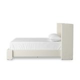 A shorter wingspan and geometric cutouts define this modern-day shelter wingback bed, designed for comfort from every angle. Upholstered in a cream fabric with subtle texture and a soft hand Amethyst Home provides interior design, new home construction design consulting, vintage area rugs, and lighting in the Alpharetta metro area.