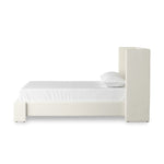 A shorter wingspan and geometric cutouts define this modern-day shelter wingback bed, designed for comfort from every angle. Upholstered in a cream fabric with subtle texture and a soft hand Amethyst Home provides interior design, new home construction design consulting, vintage area rugs, and lighting in the Calabasas metro area.