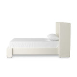 A shorter wingspan and geometric cutouts define this modern-day shelter wingback bed, designed for comfort from every angle. Upholstered in a cream fabric with subtle texture and a soft hand Amethyst Home provides interior design, new home construction design consulting, vintage area rugs, and lighting in the Calabasas metro area.