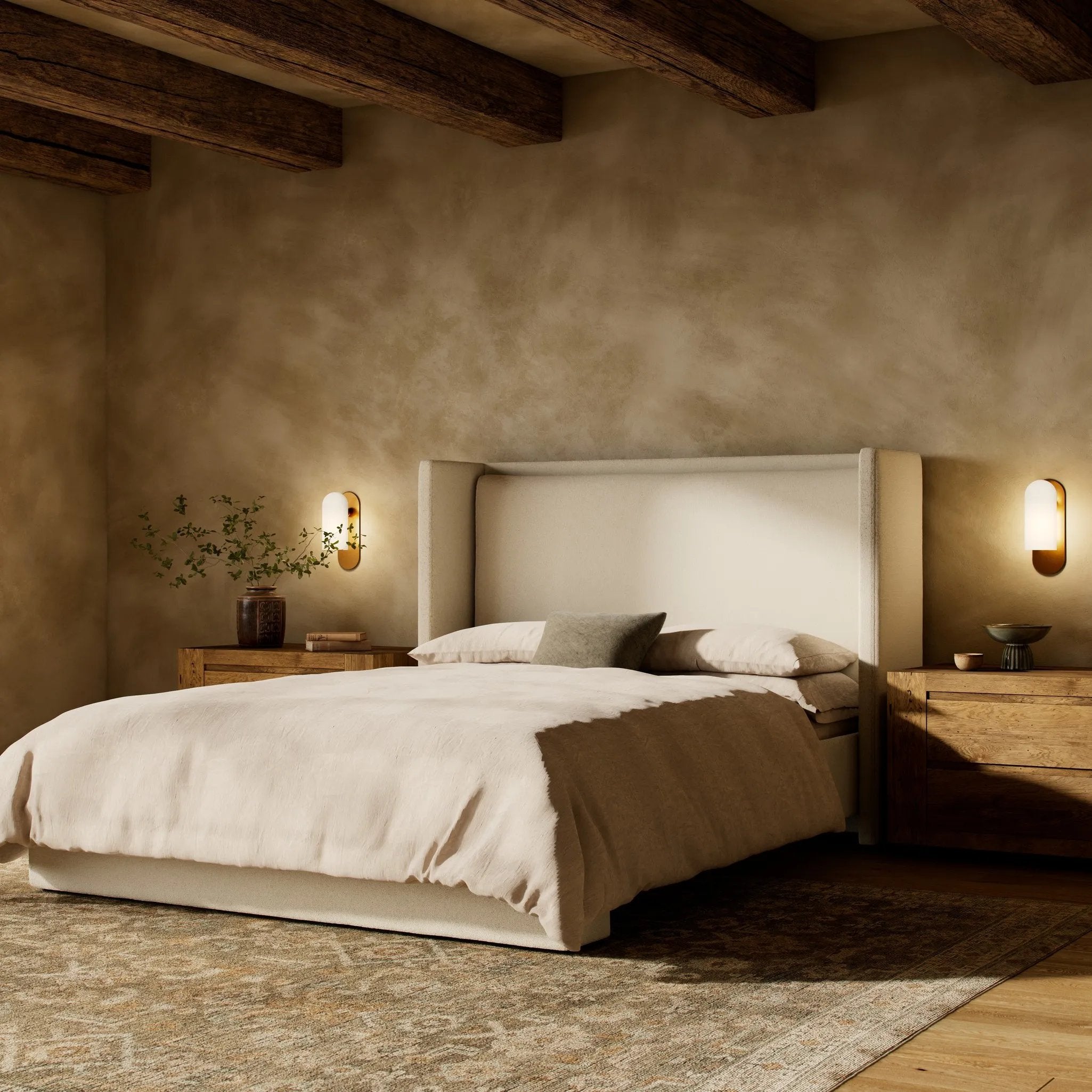 A shorter wingspan and geometric cutouts define this modern-day shelter wingback bed, designed for comfort from every angle. Upholstered in a cream fabric with subtle texture and a soft hand Amethyst Home provides interior design, new home construction design consulting, vintage area rugs, and lighting in the Miami metro area.