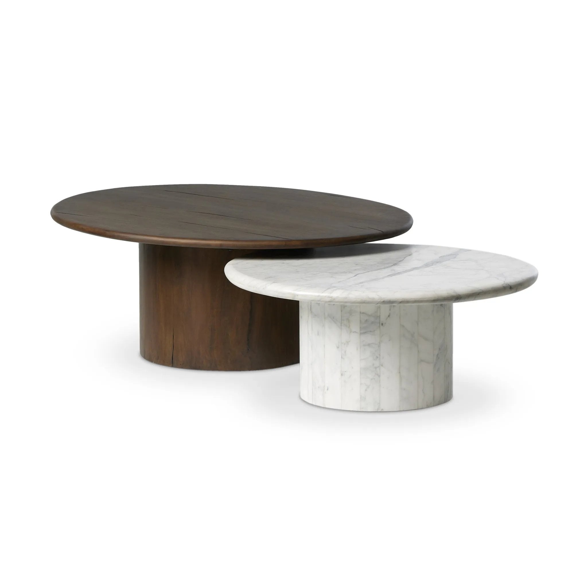 Elevate the look of your living space with a nest-style set of coffee tables — one larger table made from mixed reclaimed woods and a smaller table of white Calacatta marble. Together, they make for a true mixed materials moment Amethyst Home provides interior design, new home construction design consulting, vintage area rugs, and lighting in the Des Moines metro area.