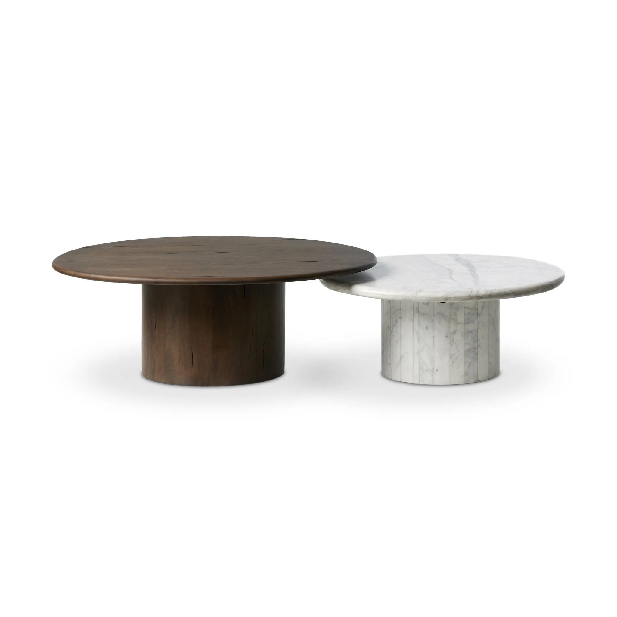 Elevate the look of your living space with a nest-style set of coffee tables — one larger table made from mixed reclaimed woods and a smaller table of white Calacatta marble. Together, they make for a true mixed materials moment Amethyst Home provides interior design, new home construction design consulting, vintage area rugs, and lighting in the Los Angeles metro area.