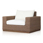 Featuring Suri Arashi Salt Outdoor Chair by Four Hands at Amethyst Home. Elevate your outdoors. A wide-format outdoor chair features a faux hyacinth frame and plinth base. Linear details and a boxy silhouette make this piece truly timeless, while a knife-edge back  cushion softens the whole look. Upholstered in 100% olefin, known for its UV-resistant, water. Amethyst Home provides interior design, new home construction design consulting, vintage area rugs, and lighting in the Charlotte metro area.