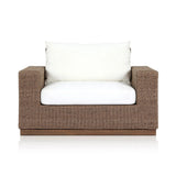 Featuring Suri Arashi Salt Outdoor Chair by Four Hands at Amethyst Home. Elevate your outdoors. A wide-format outdoor chair features a faux hyacinth frame and plinth base. Linear details and a boxy silhouette make this piece truly timeless, while a knife-edge back  cushion softens the whole look. Upholstered in 100% olefin, known for its UV-resistant, w. Amethyst Home provides interior design, new home construction design consulting, vintage area rugs, and lighting in the Winter Garden metro area.