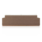 Elevate your outdoors. A wide-format outdoor sofa features a faux hyacinth frame and plinth base. Linear details and a boxy silhouette make this piece truly timeless, while knife-edge back cushions soften the whole look. Upholstered in 100% olefin, known for its UV-resistant, water-repellent and quick-drying abilities. Amethyst Home provides interior design, new home construction design consulting, vintage area rugs, and lighting in the Dallas metro area.