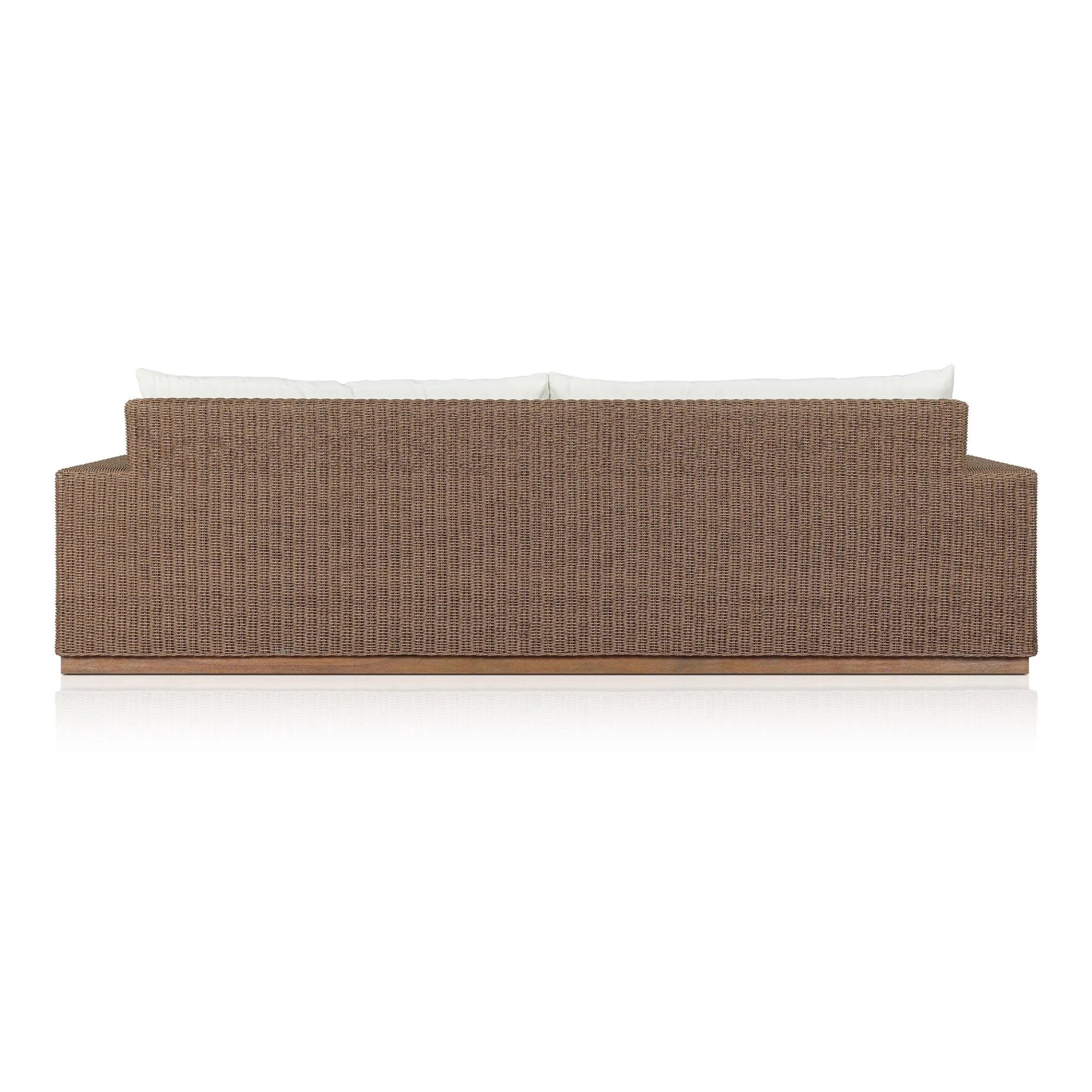 Elevate your outdoors. A wide-format outdoor sofa features a faux hyacinth frame and plinth base. Linear details and a boxy silhouette make this piece truly timeless, while knife-edge back cushions soften the whole look. Upholstered in 100% olefin, known for its UV-resistant, water-repellent and quick-drying abilities. Amethyst Home provides interior design, new home construction design consulting, vintage area rugs, and lighting in the Dallas metro area.
