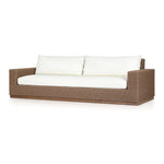 Elevate your outdoors. A wide-format outdoor sofa features a faux hyacinth frame and plinth base. Linear details and a boxy silhouette make this piece truly timeless, while knife-edge back cushions soften the whole look. Upholstered in 100% olefin, known for its UV-resistant, water-repellent and quick-drying abilities. Amethyst Home provides interior design, new home construction design consulting, vintage area rugs, and lighting in the Kansas City metro area.