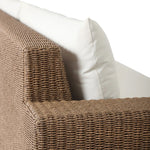Elevate your outdoors. A wide-format outdoor sofa features a faux hyacinth frame and plinth base. Linear details and a boxy silhouette make this piece truly timeless, while knife-edge back cushions soften the whole look. Upholstered in 100% olefin, known for its UV-resistant, water-repellent and quick-drying abilities. Amethyst Home provides interior design, new home construction design consulting, vintage area rugs, and lighting in the Los Angeles metro area.