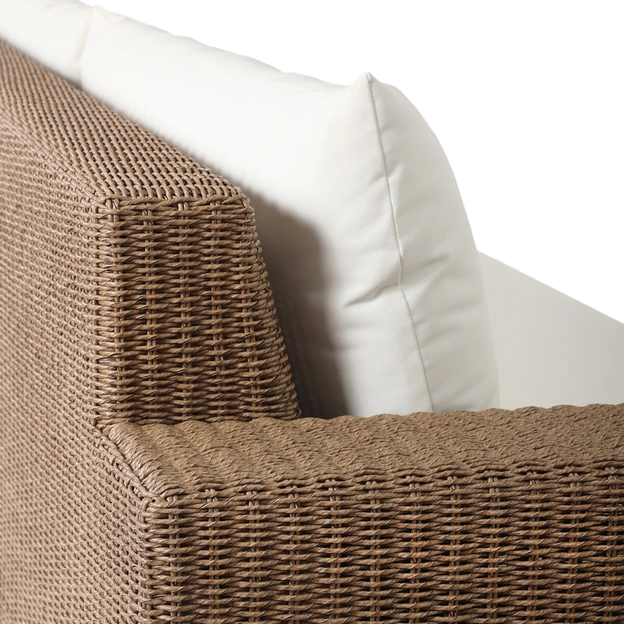 Elevate your outdoors. A wide-format outdoor sofa features a faux hyacinth frame and plinth base. Linear details and a boxy silhouette make this piece truly timeless, while knife-edge back cushions soften the whole look. Upholstered in 100% olefin, known for its UV-resistant, water-repellent and quick-drying abilities. Amethyst Home provides interior design, new home construction design consulting, vintage area rugs, and lighting in the Los Angeles metro area.