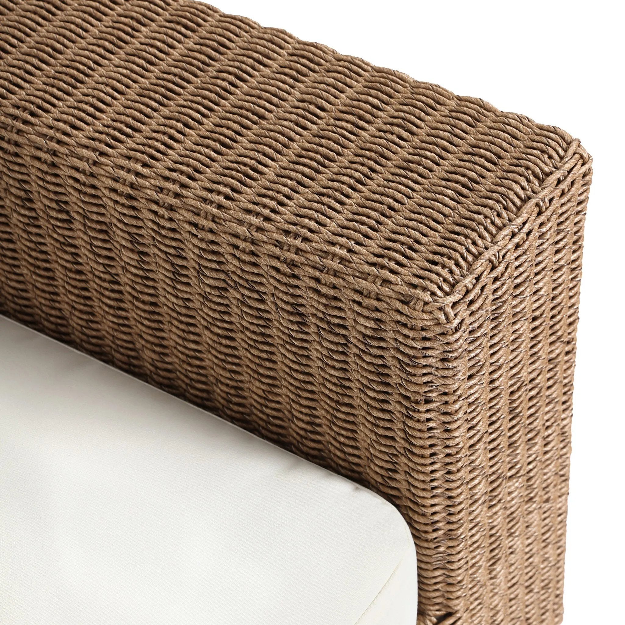 Elevate your outdoors. A wide-format outdoor sofa features a faux hyacinth frame and plinth base. Linear details and a boxy silhouette make this piece truly timeless, while knife-edge back cushions soften the whole look. Upholstered in 100% olefin, known for its UV-resistant, water-repellent and quick-drying abilities. Amethyst Home provides interior design, new home construction design consulting, vintage area rugs, and lighting in the Miami metro area.