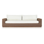 Elevate your outdoors. A wide-format outdoor sofa features a faux hyacinth frame and plinth base. Linear details and a boxy silhouette make this piece truly timeless, while knife-edge back cushions soften the whole look. Upholstered in 100% olefin, known for its UV-resistant, water-repellent and quick-drying abilities. Amethyst Home provides interior design, new home construction design consulting, vintage area rugs, and lighting in the Park City metro area.