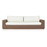 Elevate your outdoors. A wide-format outdoor sofa features a faux hyacinth frame and plinth base. Linear details and a boxy silhouette make this piece truly timeless, while knife-edge back cushions soften the whole look. Upholstered in 100% olefin, known for its UV-resistant, water-repellent and quick-drying abilities. Amethyst Home provides interior design, new home construction design consulting, vintage area rugs, and lighting in the Park City metro area.