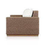 Elevate your outdoors. A wide-format outdoor sofa features a faux hyacinth frame and plinth base. Linear details and a boxy silhouette make this piece truly timeless, while knife-edge back cushions soften the whole look. Upholstered in 100% olefin, known for its UV-resistant, water-repellent and quick-drying abilities. Amethyst Home provides interior design, new home construction design consulting, vintage area rugs, and lighting in the Seattle metro area.