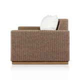 Elevate your outdoors. A wide-format outdoor sofa features a faux hyacinth frame and plinth base. Linear details and a boxy silhouette make this piece truly timeless, while knife-edge back cushions soften the whole look. Upholstered in 100% olefin, known for its UV-resistant, water-repellent and quick-drying abilities. Amethyst Home provides interior design, new home construction design consulting, vintage area rugs, and lighting in the Seattle metro area.