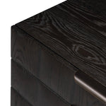 A softened Brutalist take on the traditional nightstand. The monolithic piece’s black oak veneer case sits atop a matching pedestal for an element of exaggeration. A grid pattern with inflated volume adds drama.As enthusiasts of luxe materials at Amethyst, we love the warm modern inspired Swell Nightstand - Dry Black Oak Veneer. Amethyst Home provides interior design, new home construction design consulting, vintage area rugs, and lighting in the Austin metro area.
